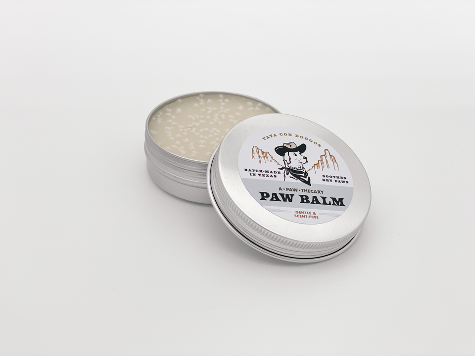 tin of dog paw balm reads unscented and gentle paw balm, made in Texas by Vaya Con Doggos